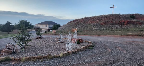The hilltop cross above the property