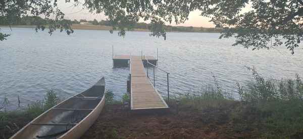 The dock and canoe on the lake