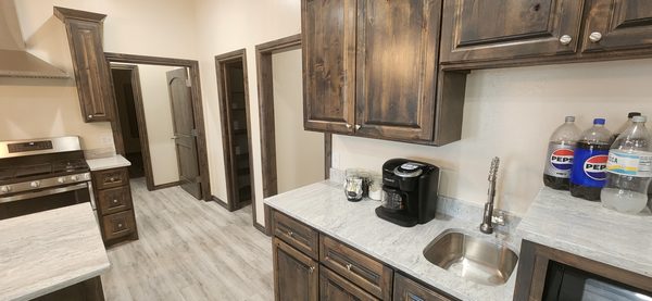 Kitchenette with sink and coffee bar