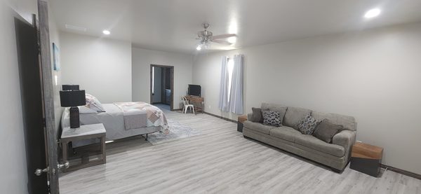 Bedroom suite with a sitting area