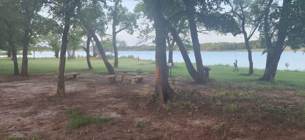 Lakeside picnic area under the trees